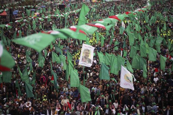 Palestinian Hamas supporters take part in a rally