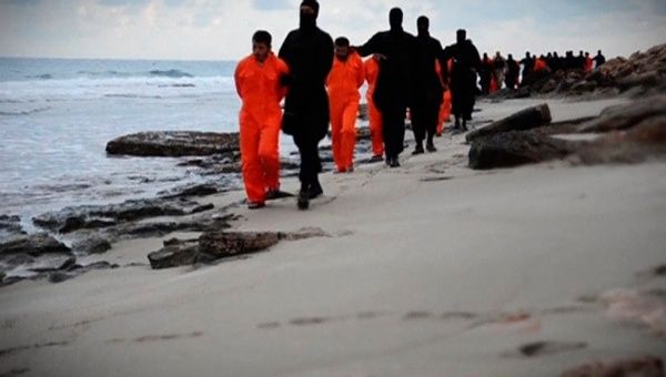 A still from the Islamic State group video showing men in orange jumpsuits purported to be Egyptian Christians, made available on social media Feb. 15, 2015