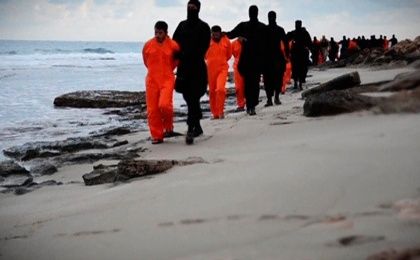 A still from the Islamic State group video showing men in orange jumpsuits purported to be Egyptian Christians, made available on social media Feb. 15, 2015