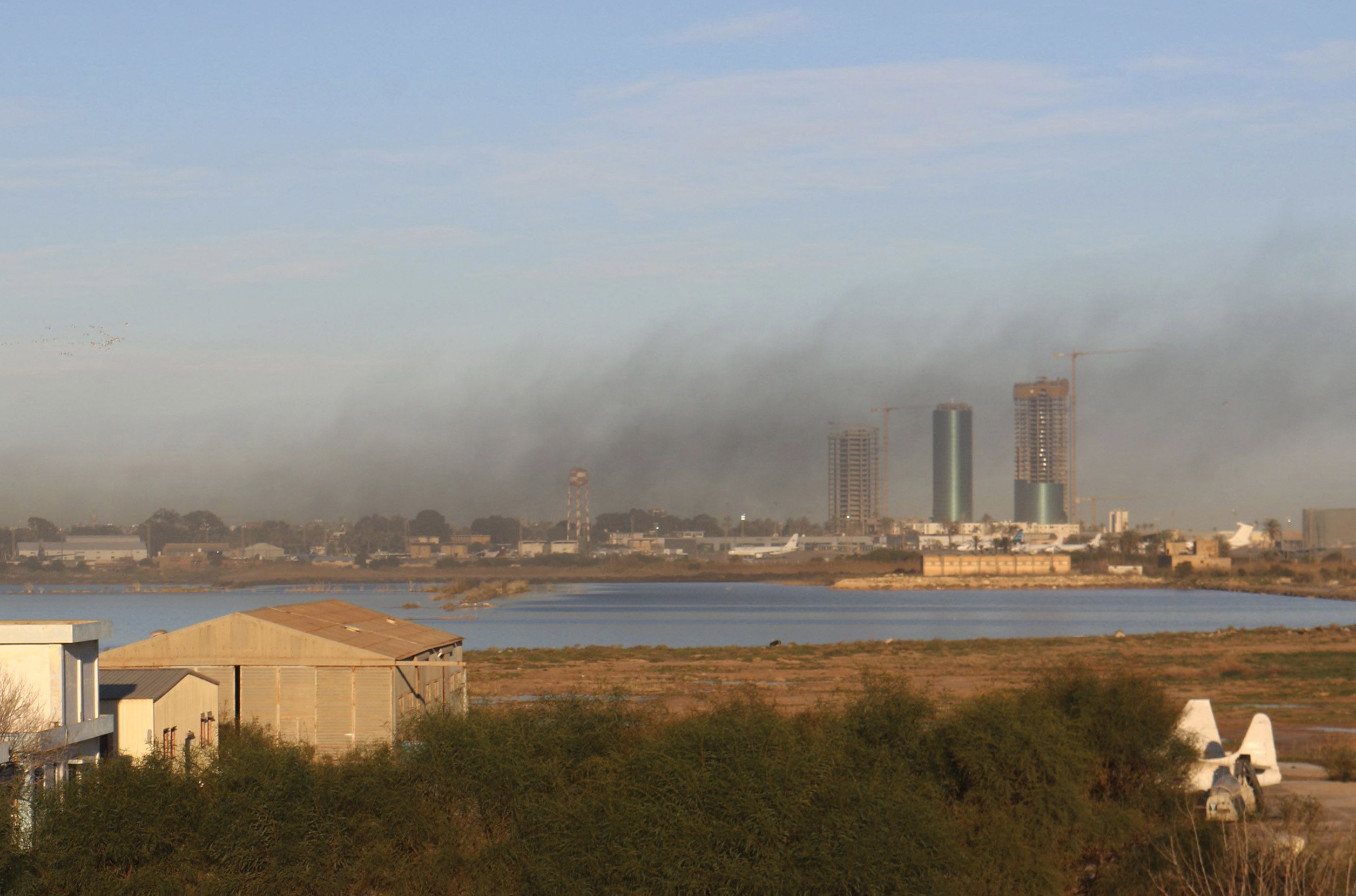 Smoke rises after an airstrike hit Maitiga airport early Thursday morning, in Tripoli March 5, 2015.