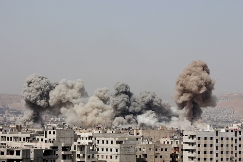 Smoke rises after what activists said were air strikes by forces loyal to Syria's President Bashar al-Assad in Arbeen, in the eastern Damascus suburb of Ghouta, March 8, 2015.