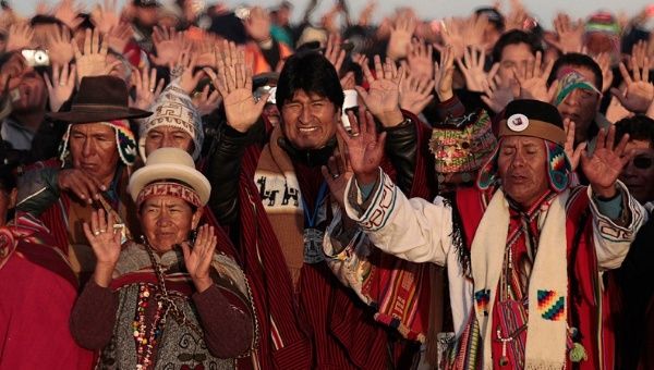 Bolivia’s President Evo Morales (center) celebrates the sunrise during a winter solstice ceremony in Tiwanaku, on June 21, 2011. 