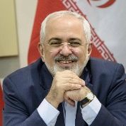 Iranian Foreign Minister Javad Zarif smiles as he waits for the start of a meeting with P5+1, European Union and Iranian officials at the Beau Rivage Palace Hotel in Lausanne March 30, 2015, during Iran nuclear talks.
