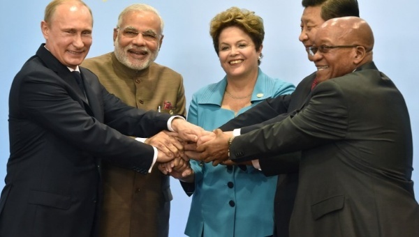 The five leaders of the BRICS nations join hands during the official photograph of the 6th BRICS summit in Fortaleza, Brazil, July 15, 2014.