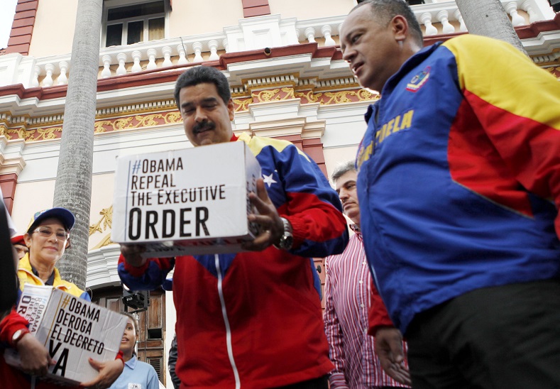 Venezuelan President Nicolas Maduro presides over a rally to celebrate the collection of 10 million signatures against Obama's decree, April 9, 2015.