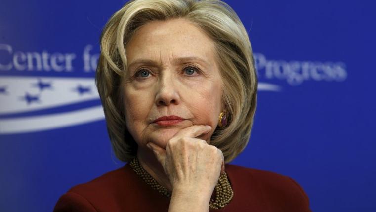Former U.S. Secretary of State Hillary Clinton listens to remarks as she takes part in a Center for American Progress roundtable discussion in Washington March 23, 2015.