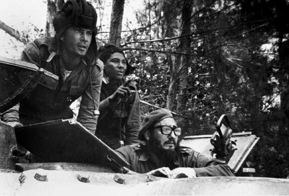 Cuban leader Fidel Castro (lower right) sits inside a tank near Playa Giron, Cuba, during the Bay of Pigs invasion, April 17, 1961.