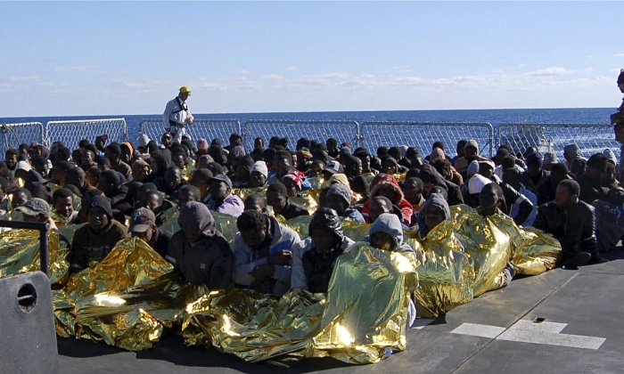 Migrants rescued by the Italian navy off the coast of Sicily
