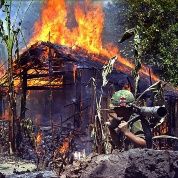 An alleged Vietcong camp is torched by U.S. soldiers.