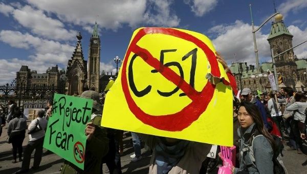 People take part in a demonstration in front of the Parliament buildings against Bill C-51, the Canadian government's proposed anti-terror legislation,  April 18, 2015.
