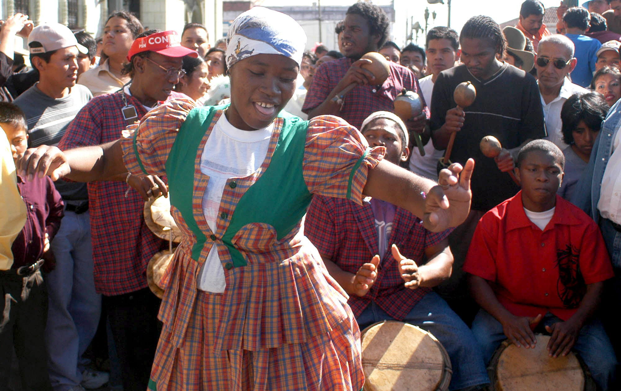 A Garifuna youth dances outside the National Palace of Culture in Guatemala City