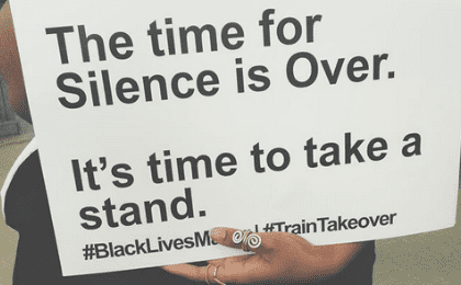With placards, activists brought facts and figures on racial inequality to the trains