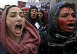 Afghan protesters demand justice for Farkhunda, the woman beaten to death by a mob in Kabul in March. They painted their faces red to symbolize the bloodied face of Farkhunda shown across social media.