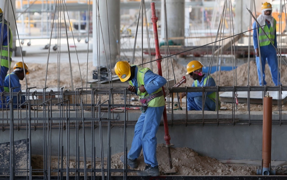 Migrant laborers at a construction site in Doha, Qatar