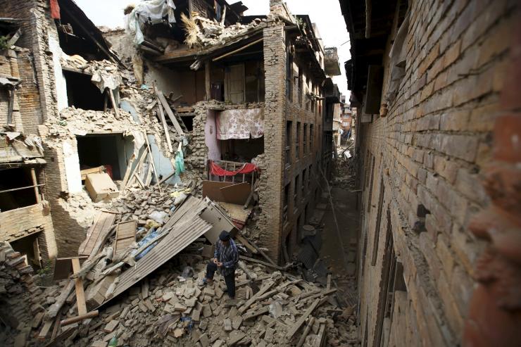People search for family members trapped inside collapsed houses a day after an earthquake in Bhaktapur, Nepal.