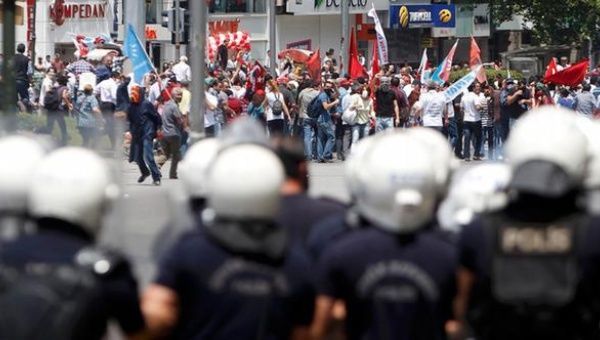 Protesters are confronted by police during a demonstration at Kizilay square in central Ankara June 16