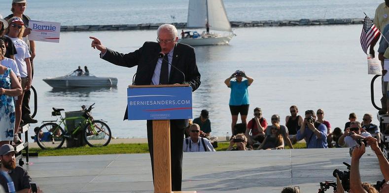 At Vermont's Lake Champlain, Democratic presidential candidate Sen. Bernie Sanders holds his 