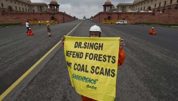 A Greenpeace activist dressed as a coal miner protests near parliament in New Delhi on Aug. 21, 2012.