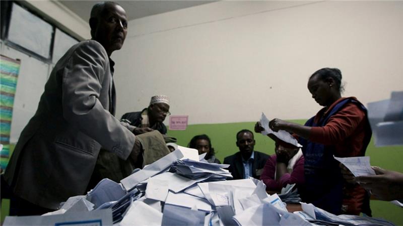 Election officials count votes at the end of voting in Addis Ababa