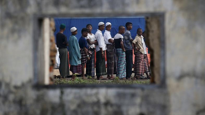 Rohingya migrants who arrived in Indonesia by boat are seen at a temporary shelter.