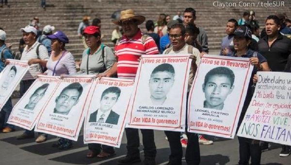 Demonstrators march demanding the return of the 43 disappeared Ayotzinapa students in Mexico City May 27, 2015.
