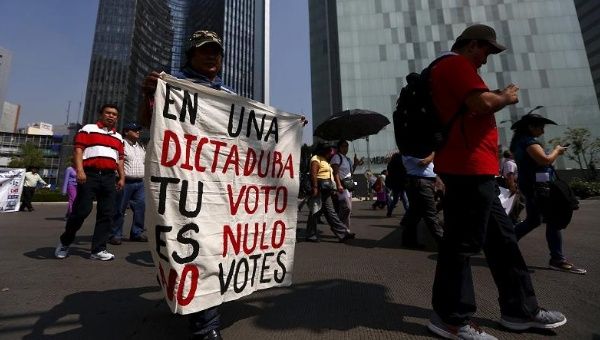 Members from the teacher's union CNTE call for a boycott of upcoming elections during a march in Mexico City, May 15, 2015.