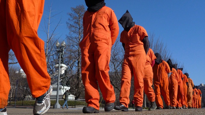 Activists dress up as Guantanamo detainees to protest against torture