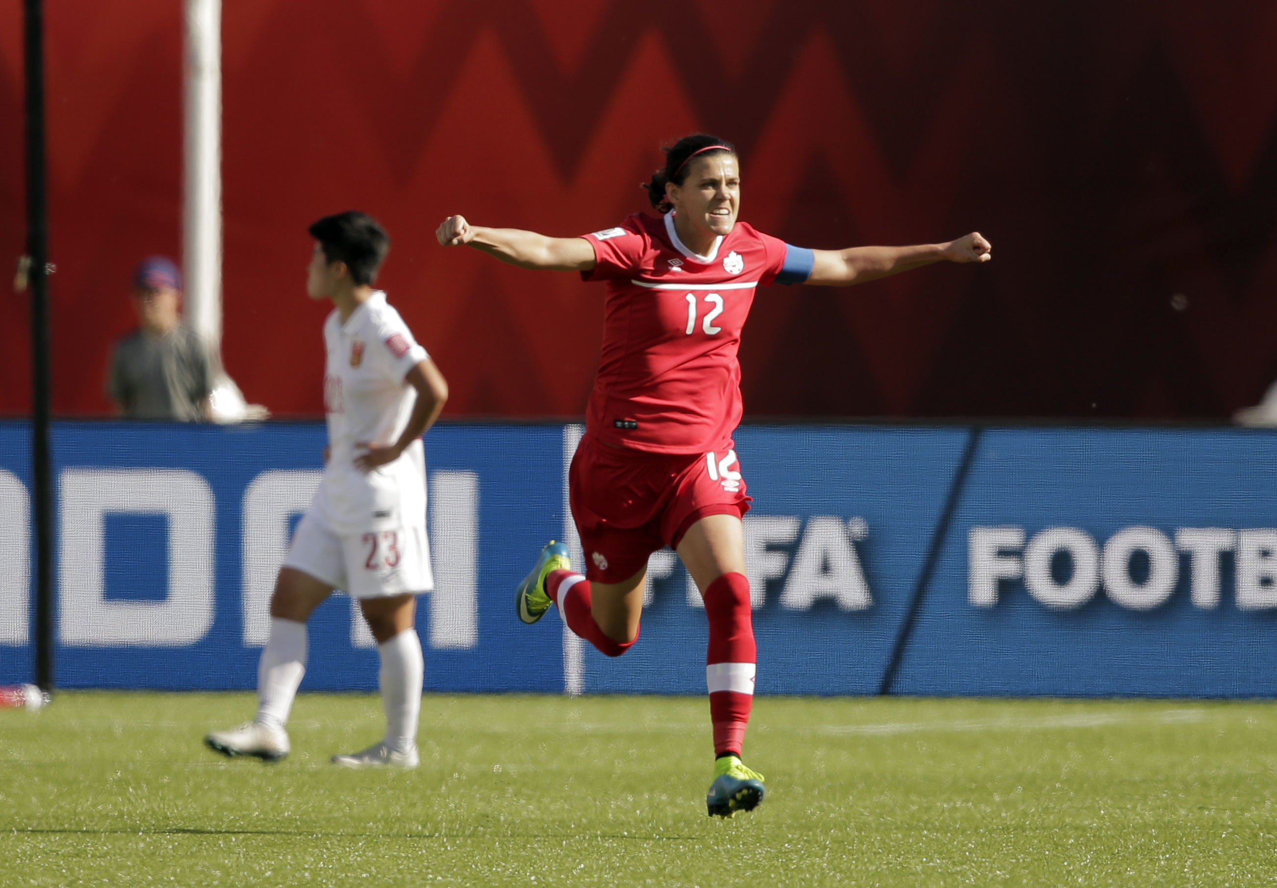 Canada forward Christine Sinclair (12) celebrates scoring a goal on a penalty kick against China.
