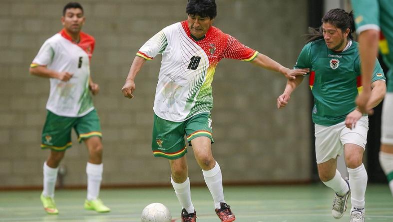 Bolivian President Evo Morales plays in a soccer match against Bolivian Roots in Brussels June 9, 2015.