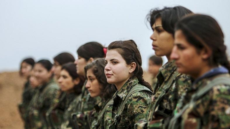 Female fighters of the Kurdish People’s Protection Units (YPG) stand at attention at a military camp in Ras a-Ain January 30, 2015