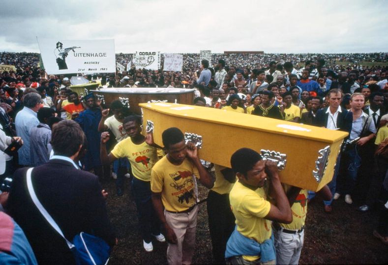 Mourners carrying coffins of those who were killed by the South African police on the 1985 International Day for the Elimination of Racial Discrimination, at Langa Township in Uitenhage. The day is commemorated each year as the anniversary of the 21 March 1960 Sharpeville massacre. 