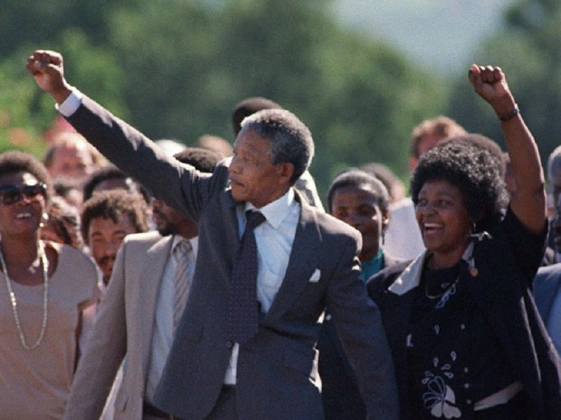 Nelson Mandela and his then-wife Winnie raising their fists and saluting cheering crowd upon Mandela's release from the Victor Verster prison February 11, 1990.