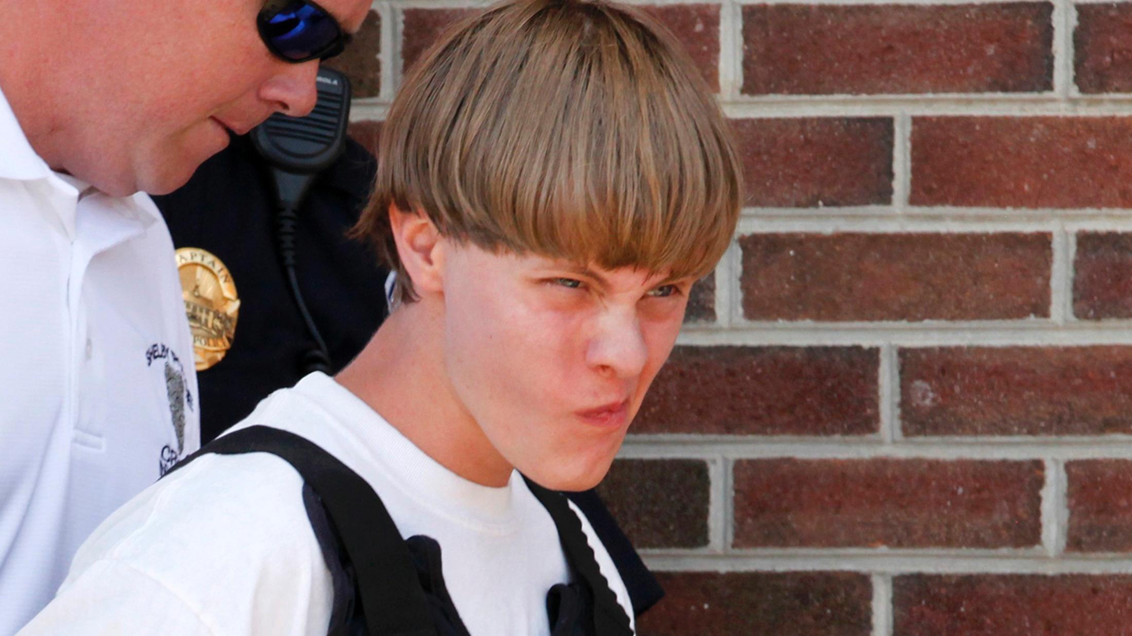 Police lead suspected shooter Dylann Roof, 21, into the courthouse in Shelby, North Carolina, June 18, 2015.