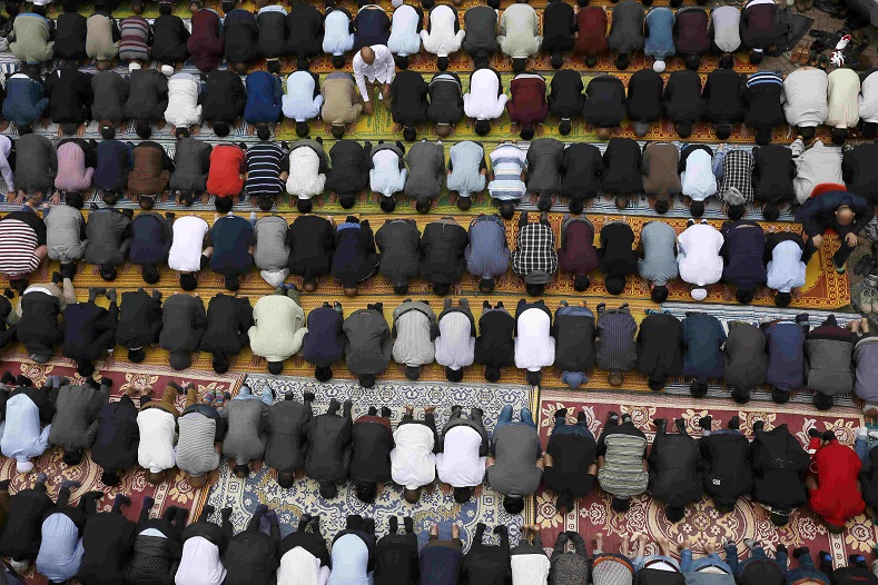 Muslims attend Friday prayer on the second day of the Ramadan in London, UK.