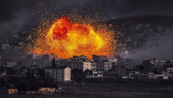 Smoke and flames rise following an explosion in the Syrian town of Kobani, also known as Ain al-Arab, as seen from the southeastern Turkish village of Mursitpinar.