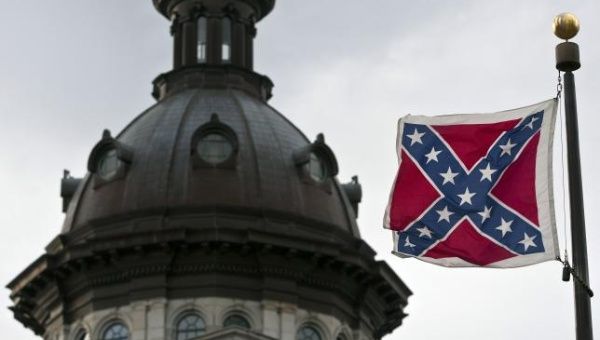The Confederate Flag flies over state grounds.