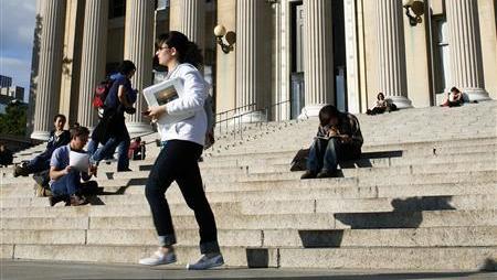 A student walks across the campus of Columbia University in New York, October 5, 2009.