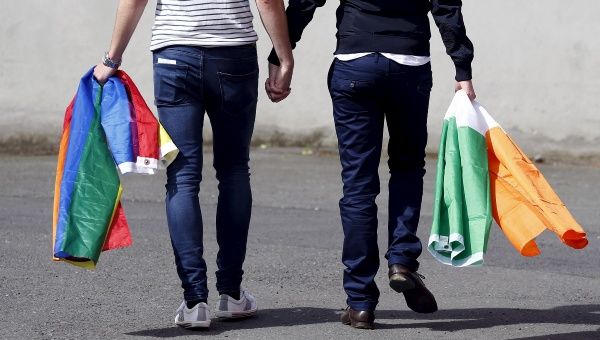 A couple walks hand in hand from the count centre in Dublin as Ireland holds a referendum on gay marriage May 23, 2015. 