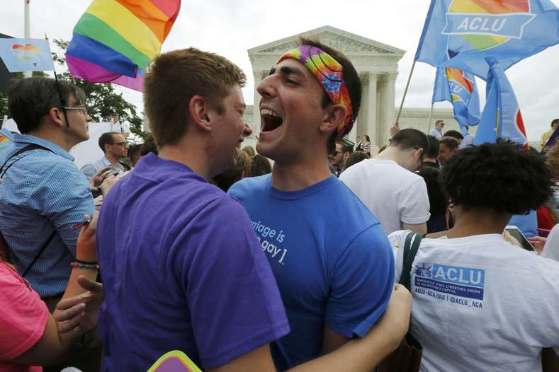 Gay rights supporters celebrate after the U.S. Supreme Court ruled that the U.S. Constitution provides same-sex couples the right to marry, outside the Supreme Court building in Washington, June 26, 2015. With the ruling, gay marriage will become legal in all 50 states.