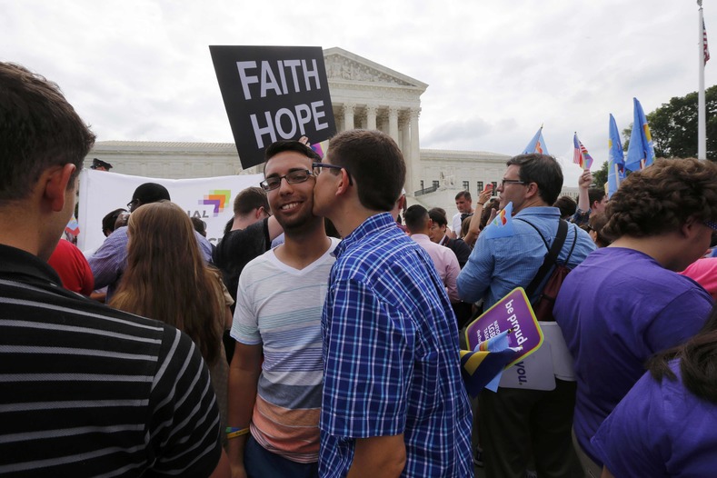  Gay rights supporters celebrate after the U.S. Supreme Court ruled that the U.S. Constitution provides same-sex couples the right to marry, outside the Supreme Court building in Washington, June 26, 2015. The court ruled 5-4 that the Constitution's guarantees of due process and equal protection under the law mean that states cannot ban same-sex marriages.