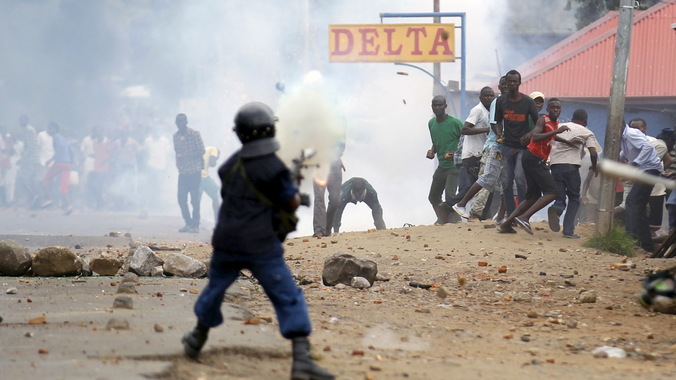 Violence erupts on the first day of Burundi polls.