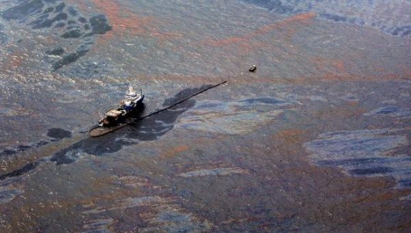 Oil floats on the surface of the Gulf of Mexico around a work boat at the site of the Deepwater Horizon oil spill in the Gulf of Mexico June 2, 2010.