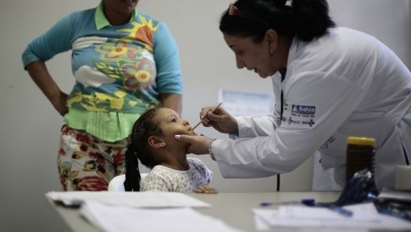A Cuban doctor examines a young patient. Cuba is widely viewed as having one of the best health systems in the region.