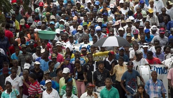 Haitian sugar cane workers with lifelong roots in the Dominican Republic march to the constitutional court in Santo Domingo to appeal appeal their deportation.