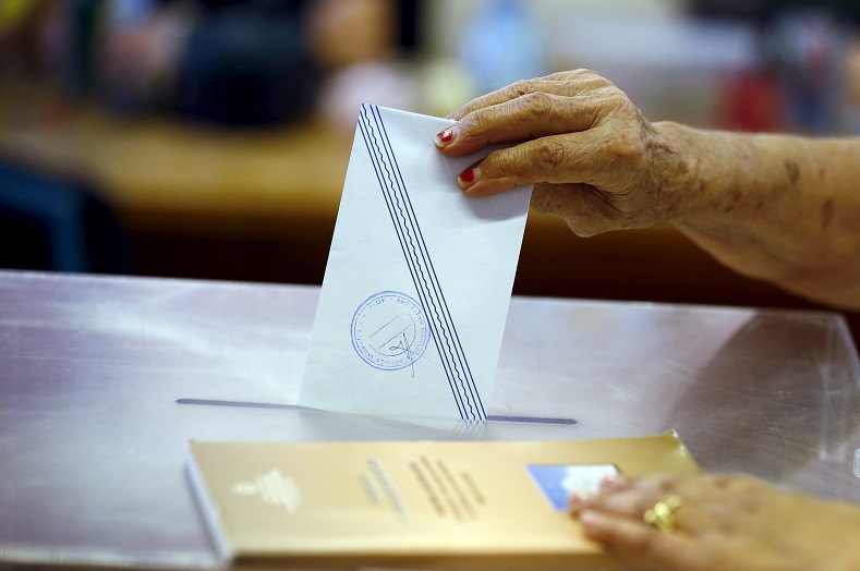 A woman casts her vote in the village of Meyisti on the Island of Kastellorizo, which is the most easterly of the islands in Greece, July 5, 2015.