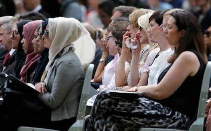 Mourners attend a memorial event to victims of the 7 July 2005 London bombings at the memorial in Hyde Park.