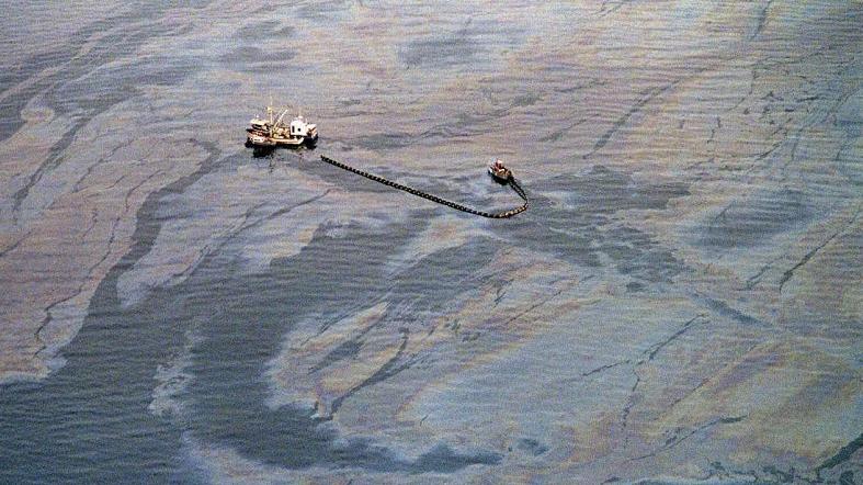 An oil skimming operation works in a heavy oil slick near Latouche Island in the southwest end of Prince William Sound on April 1, 1989.