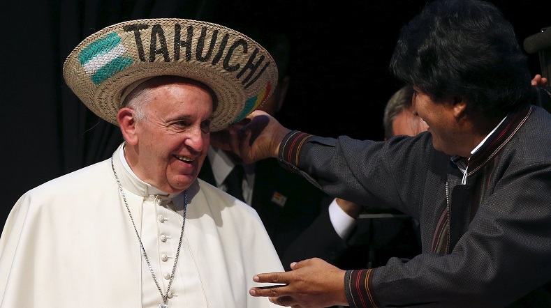 Pope Francis receives a typical sombrero from Bolivian President Evo Morales during a World Meeting of Popular Movements in Santa Cruz, Bolivia, July 9, 2015.