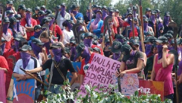 Brazilian women of La Via Campesina protest for campesino rights.