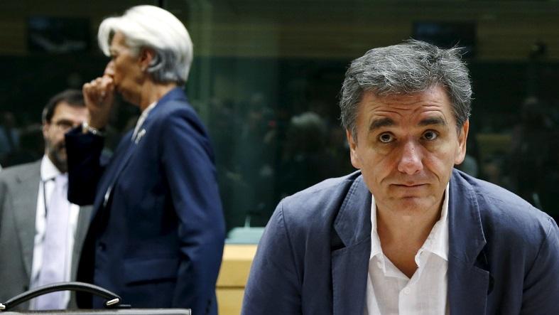 Greek Finance Minister Euclid Tsakalotos and IMF Managing Director Christine Lagarde (back L) attend a eurozone finance ministers meeting in Brussels, Belgium, July 12, 2015.
